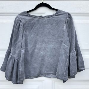 Distressed peplum sleeve top